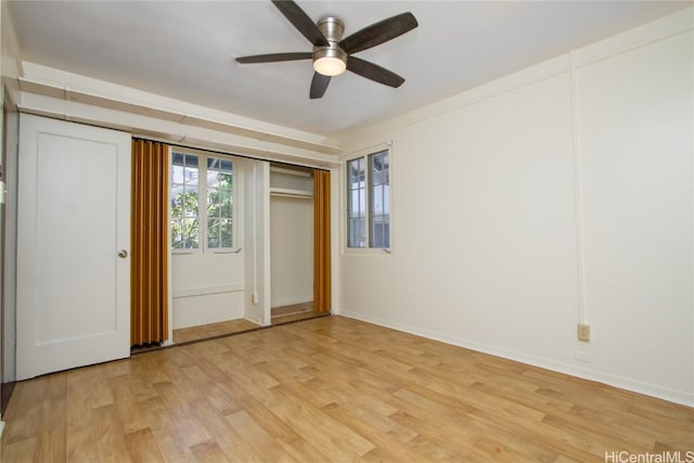 unfurnished bedroom featuring light wood-type flooring, a closet, and ceiling fan