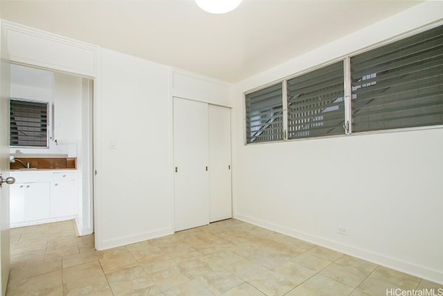 unfurnished bedroom featuring a closet