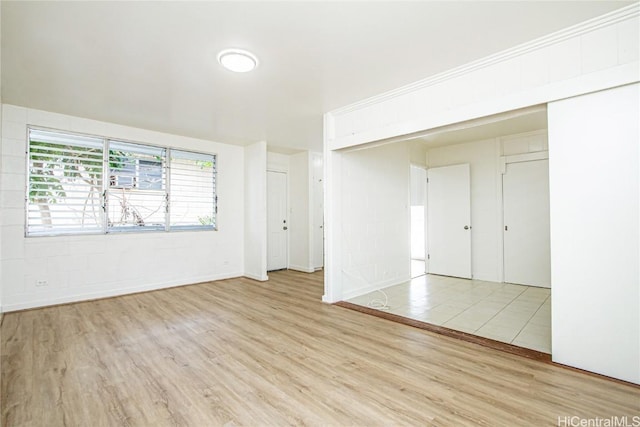 spare room featuring light wood-type flooring