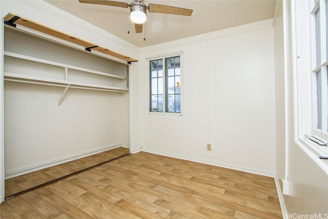 empty room featuring hardwood / wood-style flooring and ceiling fan