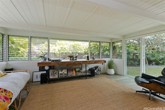 sunroom / solarium with beamed ceiling