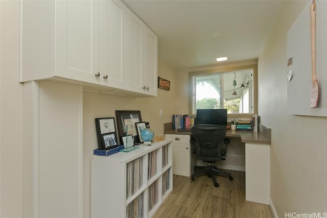 office with light hardwood / wood-style flooring