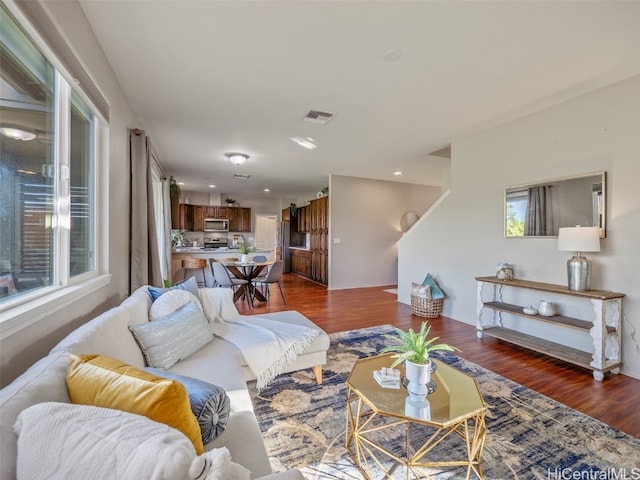 living room with dark wood-type flooring