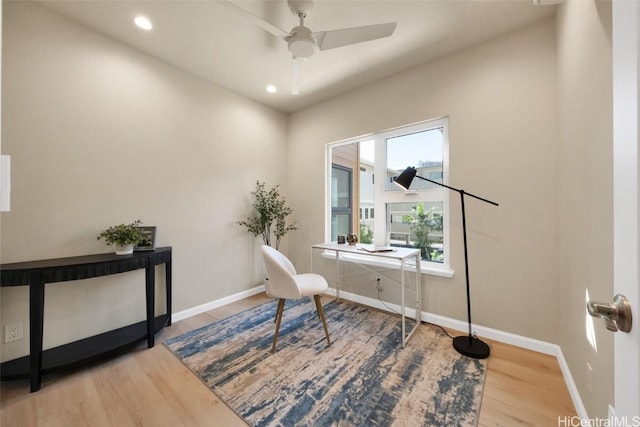 office area with ceiling fan and wood-type flooring