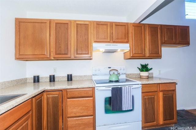 kitchen featuring light stone countertops and white electric range oven