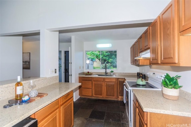 kitchen with sink, white electric range, and light stone counters