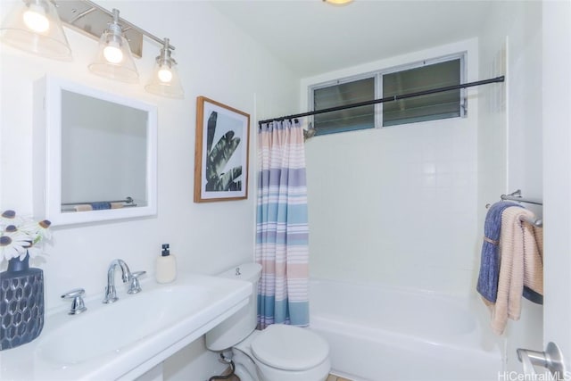 full bathroom with toilet, sink, and shower / bath combo with shower curtain