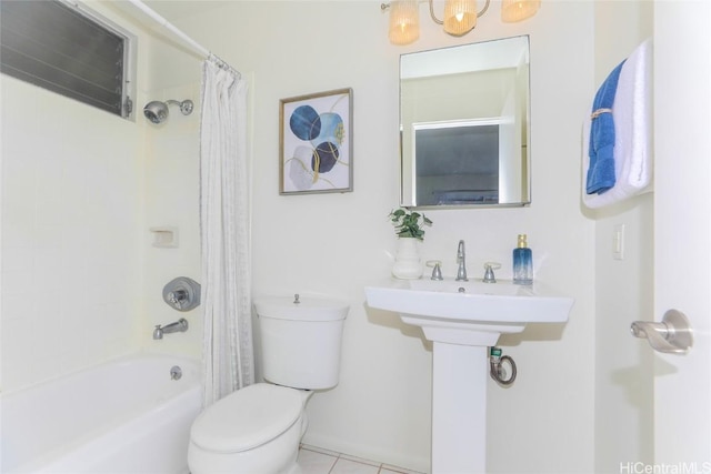 bathroom with tile patterned floors, toilet, and shower / bath combo with shower curtain