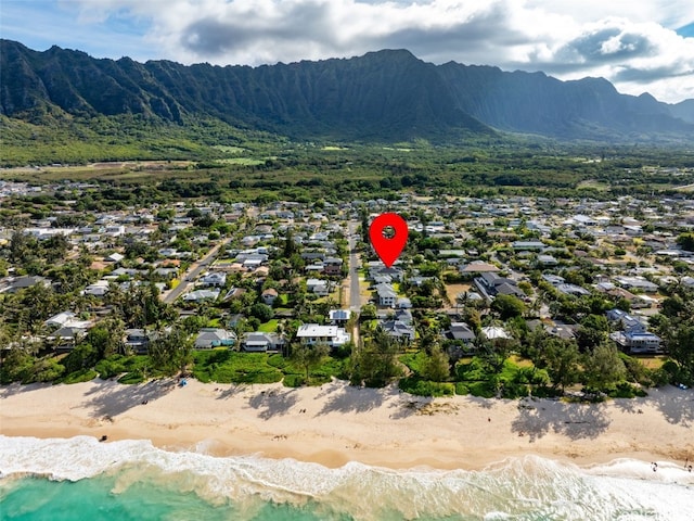 drone / aerial view with a water and mountain view