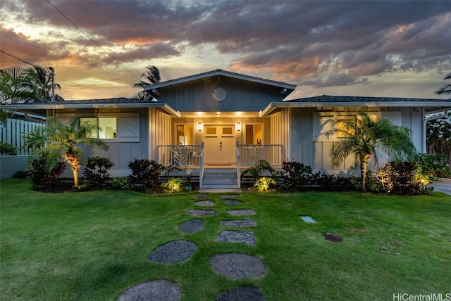 view of front of house with a yard