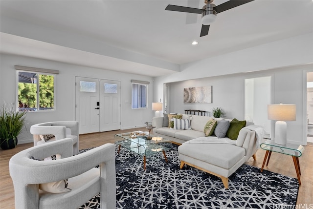 living room with ceiling fan and hardwood / wood-style floors