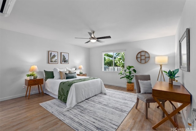 bedroom with ceiling fan and light wood-type flooring