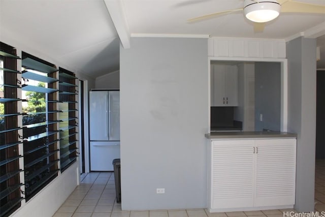 kitchen with ceiling fan and light tile patterned flooring