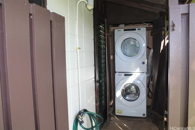 washroom with stacked washer and clothes dryer