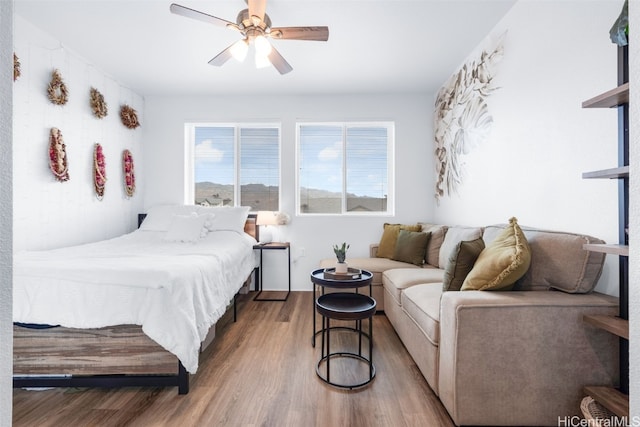 bedroom featuring ceiling fan and wood-type flooring