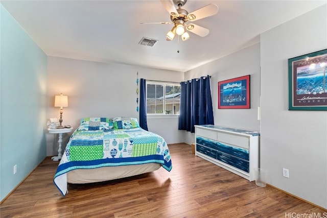 bedroom featuring hardwood / wood-style floors and ceiling fan