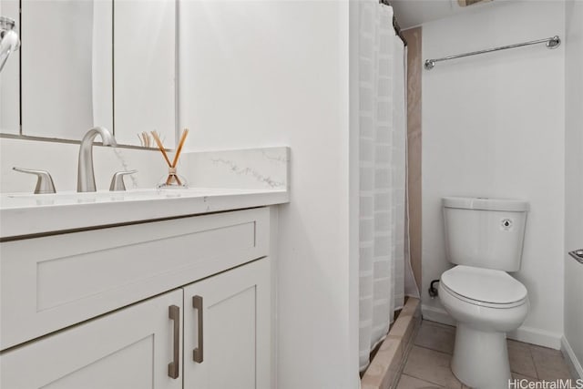 bathroom with toilet, vanity, tile patterned flooring, and a shower with curtain