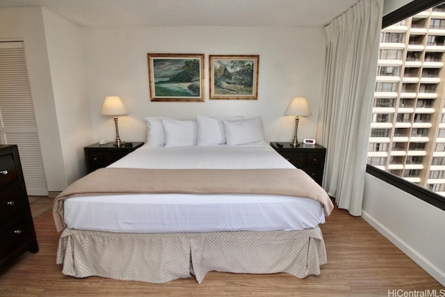 bedroom with light wood-type flooring