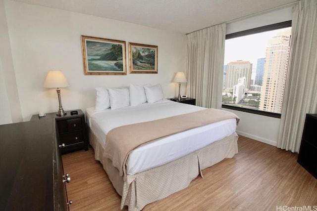 bedroom with light hardwood / wood-style flooring