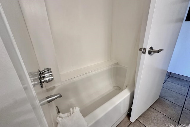 bathroom with bathing tub / shower combination and tile patterned flooring