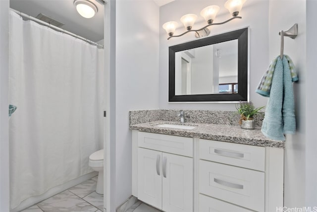 bathroom with vanity and toilet