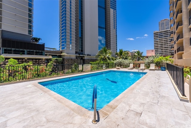 view of swimming pool with a patio