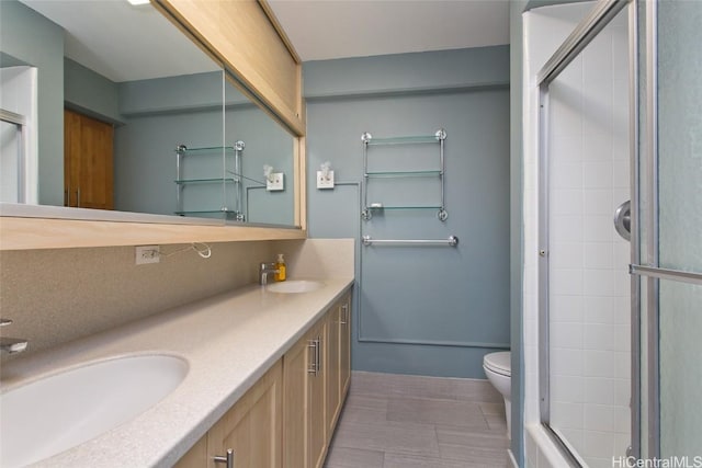 bathroom with walk in shower, vanity, and toilet