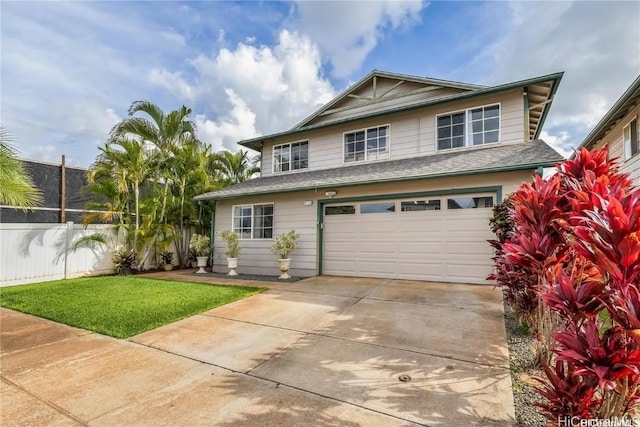 view of front of house featuring a garage and a front yard