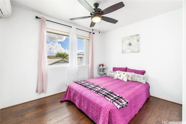 bedroom featuring ceiling fan, an AC wall unit, and dark hardwood / wood-style floors