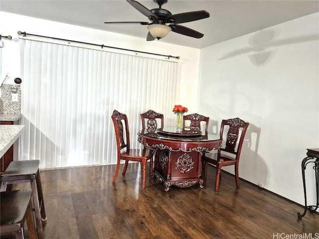 dining space featuring ceiling fan and dark hardwood / wood-style flooring