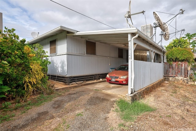 view of property exterior with a carport