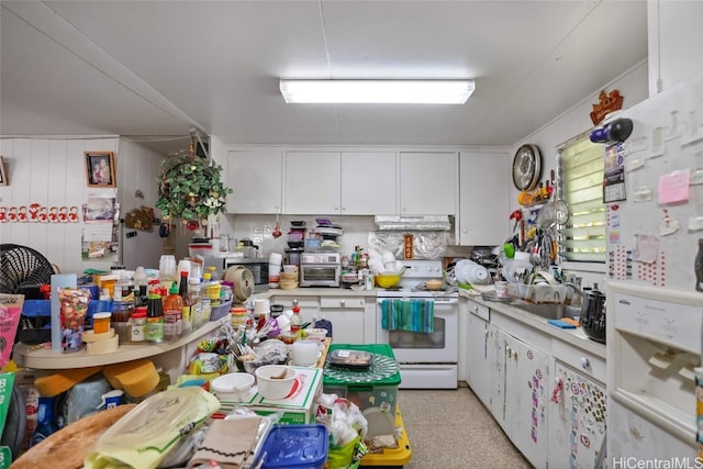 kitchen featuring sink, white cabinets, and white appliances