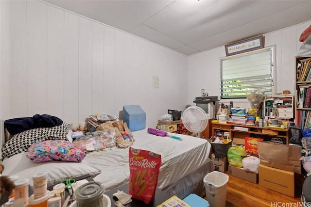 bedroom with wooden walls