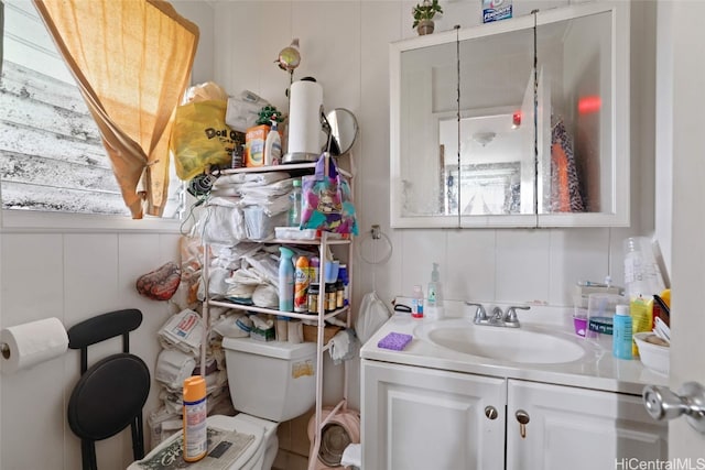 bathroom featuring vanity and toilet