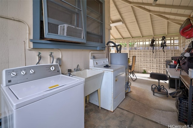 laundry room featuring sink, gas water heater, washer and clothes dryer, and wooden ceiling