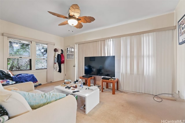 carpeted living room featuring ceiling fan