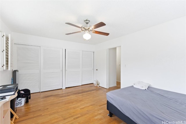 bedroom with hardwood / wood-style floors and ceiling fan