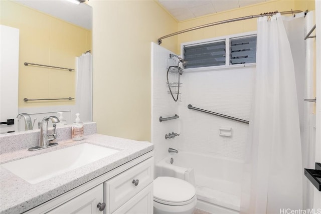 full bathroom with vanity, shower / tub combo, and toilet