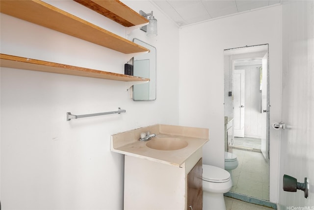 half bathroom featuring vanity and toilet