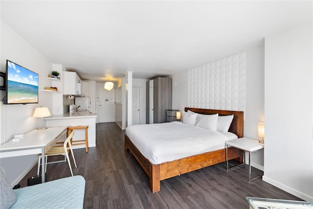 bedroom featuring dark wood-type flooring