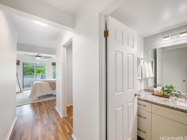 bathroom with vanity and hardwood / wood-style floors