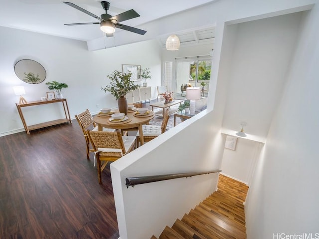 dining area with dark wood-type flooring and ceiling fan