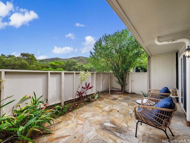 view of patio / terrace featuring a mountain view