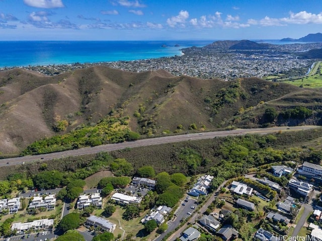 drone / aerial view with a water and mountain view