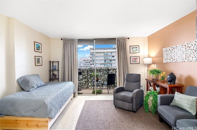 bedroom featuring access to exterior and expansive windows