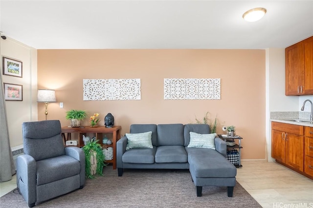 living room with sink and light hardwood / wood-style flooring