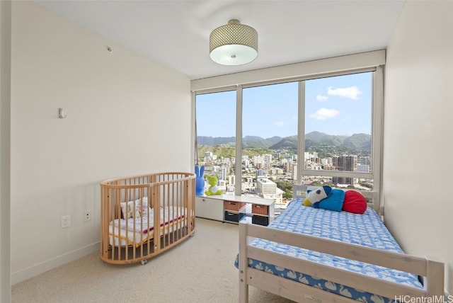 bedroom with a mountain view and carpet