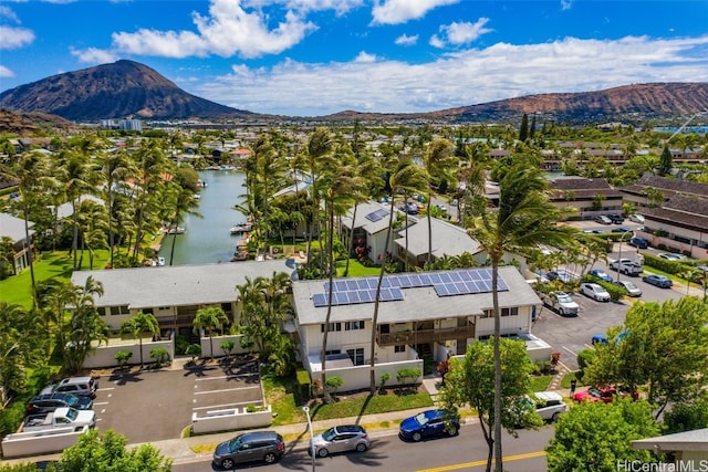 birds eye view of property featuring a water and mountain view