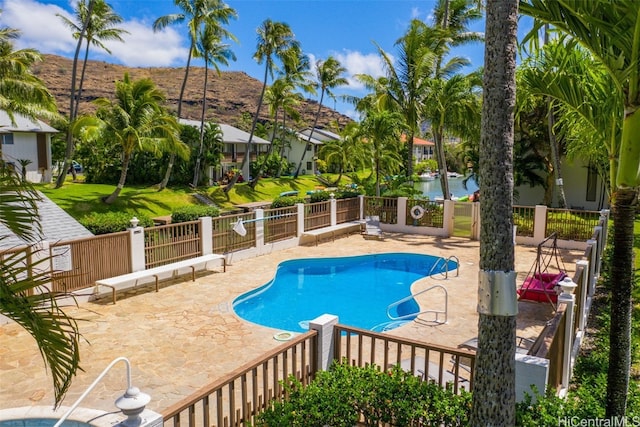 view of pool featuring a mountain view and a patio area