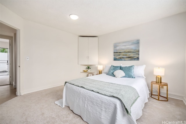 bedroom with light carpet